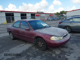1999 Ford Contour SE z VIN 1FAFP6635XK169090, wystawiony jako IAAI lot #42198696 z przebiegiem 114 933 mil mil oraz . Historia ofert i sprzedaży dostępna na DreamBid. Obrazek 1.
