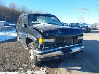 1998 Chevrolet Tahoe with VIN 3GNEK18R5WG130358, listed as a IAAI auction lot 41428005 with 218,513 mi miles. Bid and sale history available at carsss.com. Image 6.