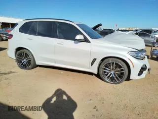 2020 BMW X5 M50i with VIN 5UXJU4C00L9B77869, listed as a Copart auction lot 36123043 with 27,195 mi miles. Bid and sale history available at carsss.com. Image 4.