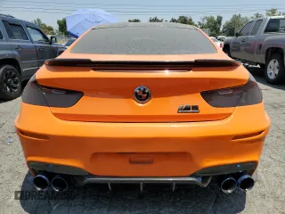 2015 BMW M6 z VIN WBSLX9C56FD160804, wystawiony jako Copart lot #57771054 z przebiegiem 57 699 mil mil oraz Szkody całkowita. Historia ofert i sprzedaży dostępna na DreamBid. Obrazek 6.