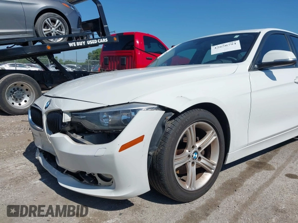 2015 BMW 3 Series 320i xDrive z VIN WBA3C3C52FP663676, wystawiony jako IAAI lot #42650794 z przebiegiem 99 774 mil mil oraz . Historia ofert i sprzedaży dostępna na DreamBid. Obrazek 6.