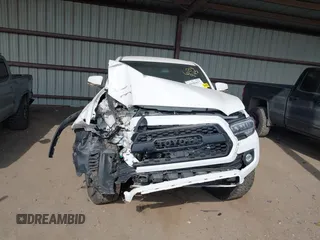 2021 Toyota Tacoma SR z VIN 3TMCZ5AN4MM373247, wystawiony jako IAAI lot #41982617 z przebiegiem 45 692 mil mil oraz . Historia ofert i sprzedaży dostępna na DreamBid. Obrazek 12.