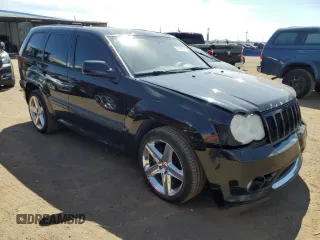 2008 Jeep Grand Cherokee SRT-8 with VIN 1J8HR78308C174606, listed as a Copart auction lot 70313584 with 169,765 mi miles and Salvage Title. Bid and sale history available at carsss.com. Image 4.
