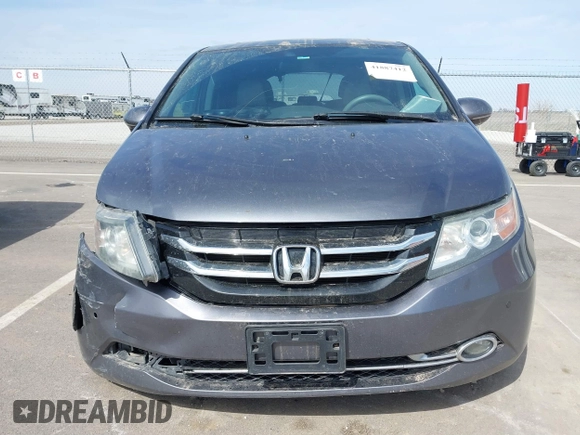 2014 Honda Odyssey Touring with VIN 5FNRL5H91EB093540, listed as a IAAI auction lot 41887412 with 202,076 mi miles and . Bid and sale history available at DreamBid. Image 12.