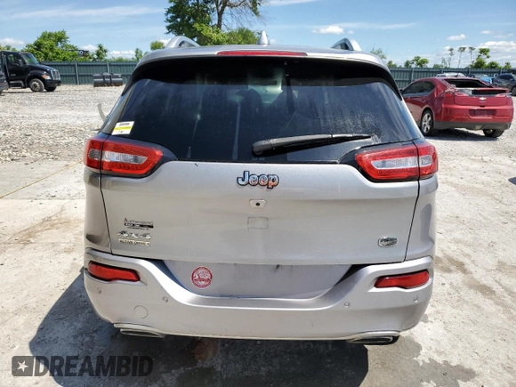 2016 Jeep Cherokee Overland z VIN 1C4PJMJSXGW300719, wystawiony jako Copart lot #58216665 z przebiegiem 128 016 mil mil oraz Szkoda całkowita • Salvage title. Historia ofert i sprzedaży dostępna na DreamBid. Obrazek 6.