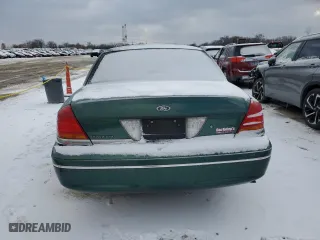 2000 Ford Crown Victoria with VIN 2FAFP73WXYX157746, listed as a Copart auction lot 82748804 with 56,820 mi miles and Salvage Title. Bid and sale history available at carsss.com. Image 6.