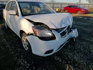 2010 Kia Rio LX with VIN KNADH4A3XA6624135, listed as a Copart auction lot 45455745 with 143,623 mi miles and Salvage Title. Bid and sale history available at carsss.com. Image 11.