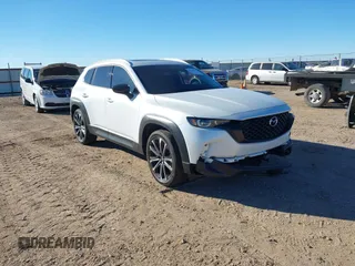 2024 Mazda CX-50 Premium z VIN 7MMVABDY0RN186511, wystawiony jako IAAI lot #41229255 z przebiegiem 21 842 mil mil oraz . Historia ofert i sprzedaży dostępna na DreamBid. Obrazek 1.