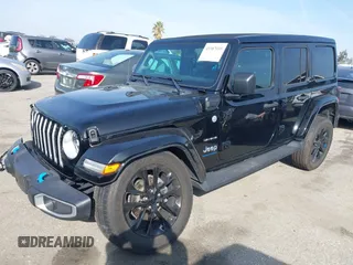 2023 Jeep Wrangler Sahara with VIN 1C4JJXP67PW556933, listed as a IAAI auction lot 41587035 with 20,463 mi miles and . Bid and sale history available at DreamBid. Image 2.