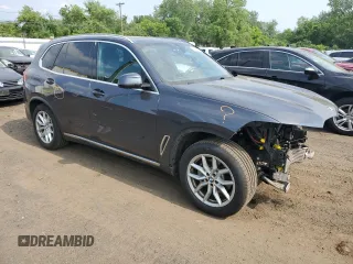 2019 BMW X5 xDrive40i with VIN 5UXCR6C57KLL11051, listed as a Copart auction lot 60268695 with 169,671 mi miles and Salvage title. Bid and sale history available at DreamBid. Image 4.