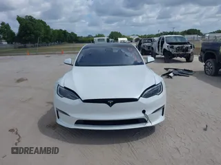 2022 Tesla Model S Plaid with VIN 5YJSA1E6XNF473888, listed as a IAAI auction lot 42141141 with 28,584 mi miles and . Bid and sale history available at carsss.com. Image 12.