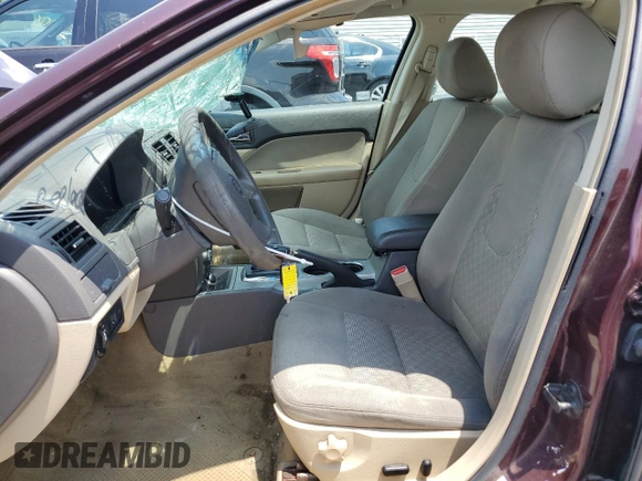 2012 Ford Fusion SE z VIN 3FAHP0HAXCR253297, wystawiony jako Copart lot #60302645 z przebiegiem 138 619 mil mil oraz Szkoda całkowita • Salvage title. Historia ofert i sprzedaży dostępna na DreamBid. Obrazek 7.
