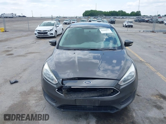 2016 Ford Focus SE z VIN 1FADP3F2XGL298174, wystawiony jako IAAI lot #42468032 z przebiegiem 236 803 mil mil oraz . Historia ofert i sprzedaży dostępna na DreamBid. Obrazek 6.