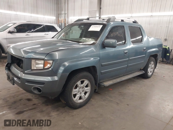 2006 Honda Ridgeline RTL with VIN 2HJYK16556H508101, listed as a IAAI auction lot 41909651 with 301,945 mi miles. Bid and sale history available at carsss.com. Image 2.