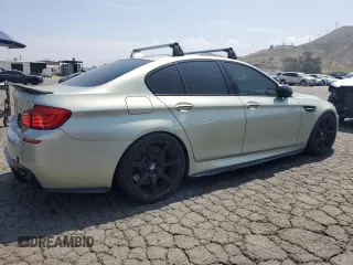 2013 BMW M5 z VIN WBSFV9C56DC774094, wystawiony jako Copart lot #55302565 z przebiegiem 100 605 mil mil oraz Tytuł czysty. Historia ofert i sprzedaży dostępna na DreamBid. Obrazek 3.