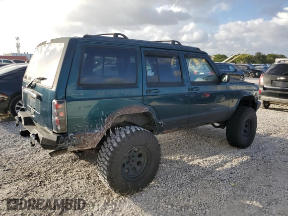 1998 Jeep Cherokee Country with VIN 1J4FT78S8XL520854, listed as a Copart auction lot 79304214 with 111,674 mi miles and Clean title. Bid and sale history available at DreamBid. Image 3.