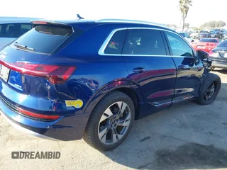 2021 Audi e-tron Premium with VIN WA1AAAGE4MB014383, listed as a IAAI auction lot 41298787 with 63,214 mi miles. Bid and sale history available at carsss.com. Image 4.