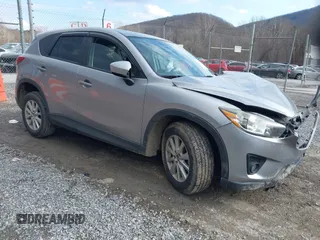 2013 Mazda CX-5 Touring with VIN JM3KE2CE9D0133348, listed as a IAAI auction lot 41357592 with 122,227 mi miles. Bid and sale history available at carsss.com. Image 1.
