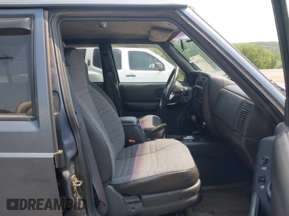 2001 Jeep Cherokee Sport z VIN 1J4FF48S51L531033, wystawiony jako IAAI lot #42423910 z przebiegiem 90 438 mil mil oraz . Historia ofert i sprzedaży dostępna na DreamBid. Obrazek 5.