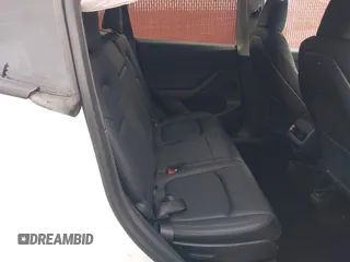 2023 Tesla Model Y Long Range with VIN 7SAYGAEE9PF702910, listed as a IAAI auction lot 42199519 with 91,094 mi miles and . Bid and sale history available at DreamBid. Image 8.
