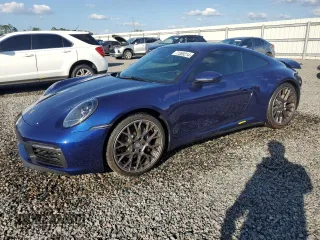 2021 Porsche 911 Carrera with VIN WP0AA2A97MS206873, listed as a Copart auction lot 77359214 with 1,036 mi miles and Salvage Title. Bid and sale history available at carsss.com. Image 1.