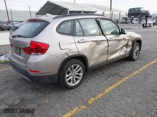 2015 BMW X1 xDrive28i with VIN WBAVL1C55FVY41749, listed as a IAAI auction lot 40977221 with 120,924 mi miles. Bid and sale history available at carsss.com. Image 4.