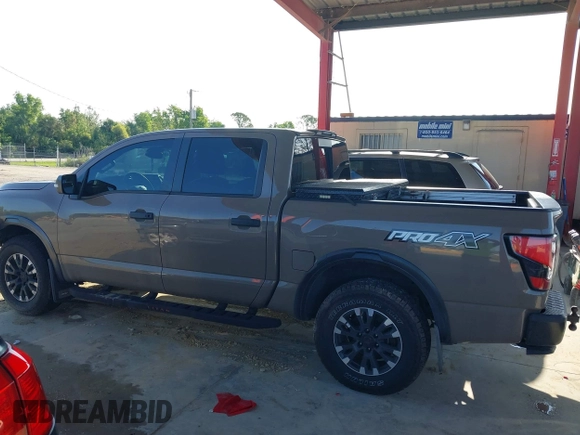 2021 Nissan Titan SV with VIN 1N6AA1ED1MN523973, listed as a IAAI auction lot 42406382 with 73,688 mi miles and . Bid and sale history available at DreamBid. Image 14.
