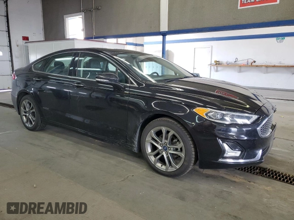 2020 Ford Fusion Titanium with VIN 3FA6P0RUXLR182408, listed as a Copart auction lot 56897105 with 100,021 mi miles and Salvage title. Bid and sale history available at DreamBid. Image 4.