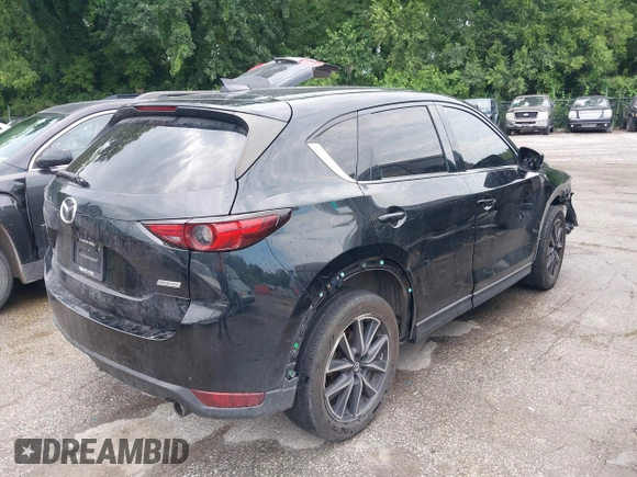 2018 Mazda CX-5 Grand Touring with VIN JM3KFBDM2J0400828, listed as a IAAI auction lot 42540846 with 254,672 mi miles and . Bid and sale history available at DreamBid. Image 4.