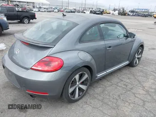 2012 Volkswagen Beetle 2.0T Turbo w/Sun/Snd/Nav PZEV with VIN 3VWVA7AT5CM653829, listed as a IAAI auction lot 42121383 with 114,474 mi miles. Bid and sale history available at carsss.com. Image 4.