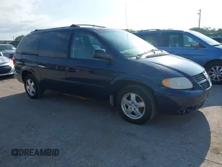 2005 Dodge Caravan SXT with VIN 2D4GP44L65R565519, listed as a IAAI auction lot 42730269 with 124,848 mi miles and . Bid and sale history available at DreamBid. Image 1.
