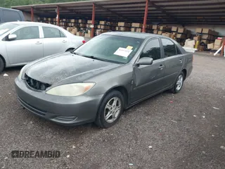 2004 Toyota Camry LE with VIN 4T1BE30K24U921028, listed as a IAAI auction lot 42187174 with 295,174 mi miles and . Bid and sale history available at DreamBid. Image 2.