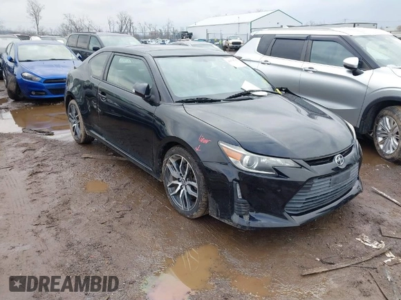 2014 Scion tC with VIN JTKJF5C74E3069104, listed as a IAAI auction lot 41579797 with 130,668 mi miles. Bid and sale history available at carsss.com. Image 1.