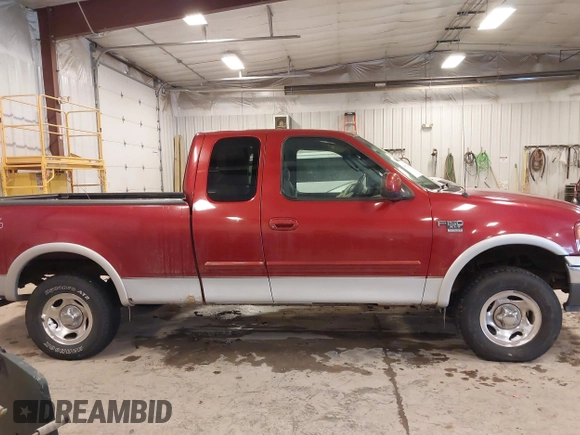 2003 Ford F-150 XL with VIN 1FTRX18L33NB82694, listed as a IAAI auction lot 41612431 with 179,664 mi miles. Bid and sale history available at carsss.com. Image 13.