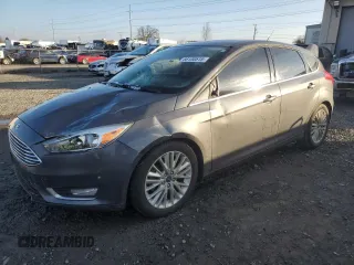 2017 Ford Focus Titanium with VIN 1FADP3N24HL287982, listed as a Copart auction lot 88100515 with 103,615 mi miles and Salvage Title. Bid and sale history available at carsss.com. Image 1.