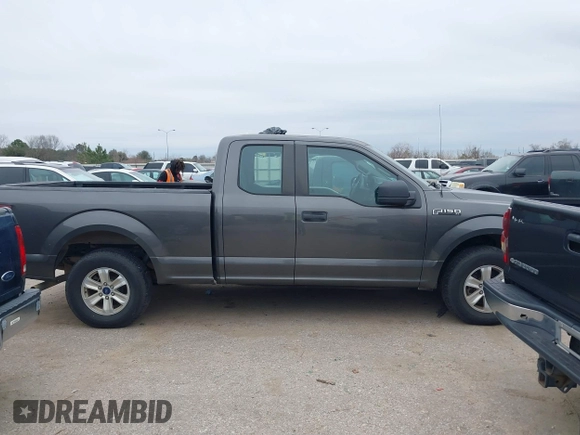2015 Ford F-150 XL with VIN 1FTEX1CF6FKF02242, listed as a IAAI auction lot 41478528 with 144,197 mi miles. Bid and sale history available at carsss.com. Image 13.