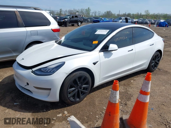 2020 Tesla Model 3 Standard Range Plus with VIN 5YJ3E1EA3LF785951, listed as a IAAI auction lot 41919339 with 63,025 mi miles and . Bid and sale history available at carsss.com. Image 18.