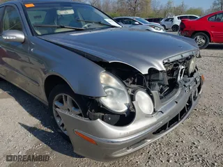 2003 Mercedes-Benz E-Class 3.2L with VIN WDBUF65J93X099223, listed as a IAAI auction lot 42033473 with 230,758 mi miles. Bid and sale history available at carsss.com. Image 17.