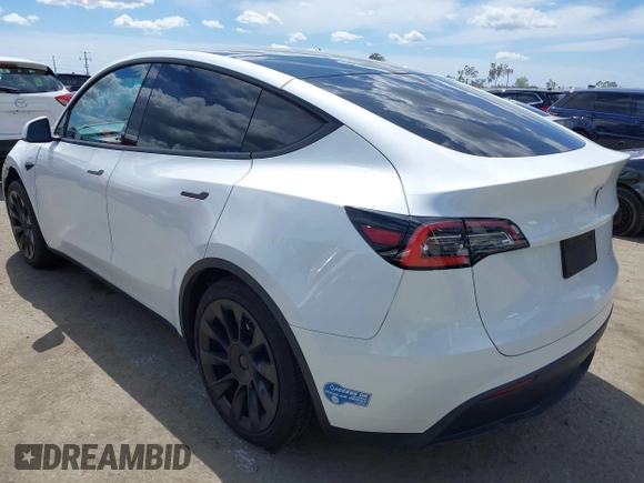 2020 Tesla Model Y Long Range with VIN 5YJYGDEE2LF058515, listed as a IAAI auction lot 41932748 with 62,885 mi miles and . Bid and sale history available at DreamBid. Image 3.