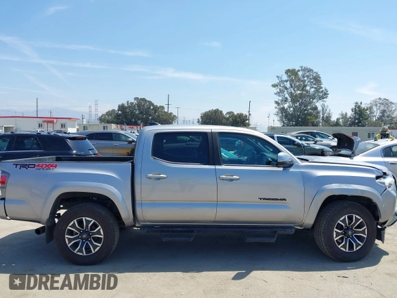 2021 Toyota Tacoma SR with VIN 3TMCZ5AN6MM393306, listed as a IAAI auction lot 42094095 with 57,217 mi miles and . Bid and sale history available at DreamBid. Image 13.