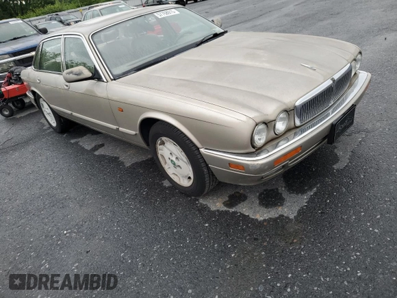 1995 Jaguar XJ with VIN SAJHX174XSC738856, listed as a Copart auction lot 57768915 with Not provided miles and Salvage title. Bid and sale history available at DreamBid. Image 4.