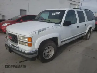 1995 GMC Suburban z VIN 1GKEC16K7SJ713765, wystawiony jako Copart lot #81694854 z przebiegiem 229 931 mil mil oraz Czysty tytuł • Clean title. Historia ofert i sprzedaży dostępna na DreamBid. Obrazek 1.
