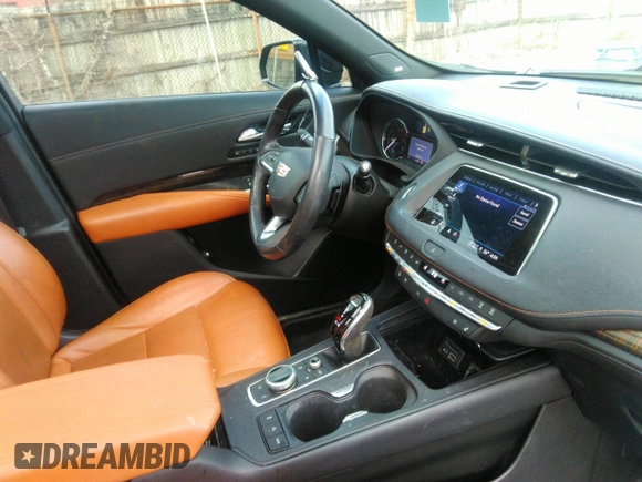 2021 Cadillac XT4 AWD Sport with VIN 1GYFZFR48MF009552, listed as a IAAI auction lot 41743125 with 53,982 mi miles and . Bid and sale history available at DreamBid. Image 5.