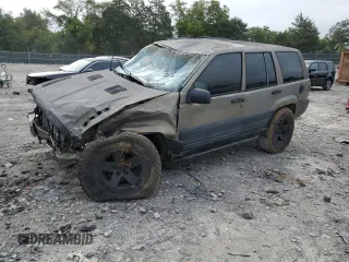 1996 Jeep Grand Cherokee Laredo with VIN 1J4GZ58S3TC297818, listed as a Copart auction lot 67712584 with 284,653 mi miles and Salvage Title. Bid and sale history available at carsss.com. Image 1.