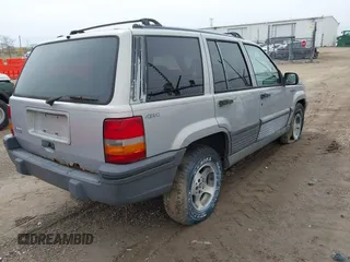 1995 Jeep Grand Cherokee Laredo with VIN 1J4GZ58S4SC532578, listed as a IAAI auction lot 41936041 with 161,777 mi miles. Bid and sale history available at carsss.com. Image 4.