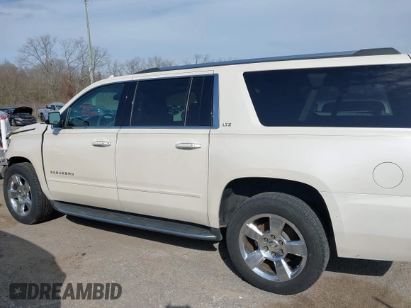 2015 Chevrolet Suburban LTZ with VIN 1GNSCKKC2FR741040, listed as a IAAI auction lot 41709574 with 87,795 mi miles and . Bid and sale history available at DreamBid. Image 14.
