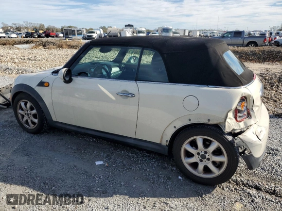 2010 MINI Convertible with VIN WMWMR3C55ATU97172, listed as a Copart auction lot 42726215 with 99,164 mi miles and Salvage Title. Bid and sale history available at DreamBid. Image 2.
