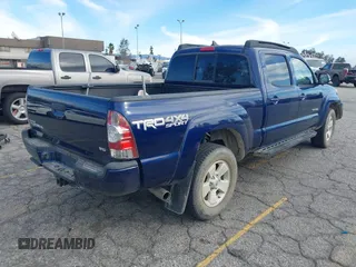 2015 Toyota Tacoma with VIN 3TMMU4FN0FM077148, listed as a IAAI auction lot 41274934 with 112,617 mi miles and . Bid and sale history available at DreamBid. Image 4.