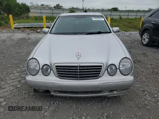 2000 Mercedes-Benz E 320 with VIN WDBJF65J1YB099417, listed as a Copart auction lot 54656915 with 130,387 mi miles and Salvage Title. Bid and sale history available at DreamBid. Image 5.