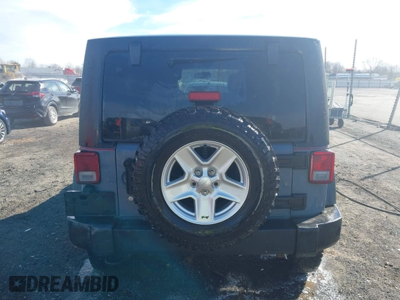 2015 Jeep Wrangler Unlimited Willys Wheeler with VIN 1C4BJWDG4FL589822, listed as a IAAI auction lot 41732614 with 149,112 mi miles and . Bid and sale history available at DreamBid. Image 17.
